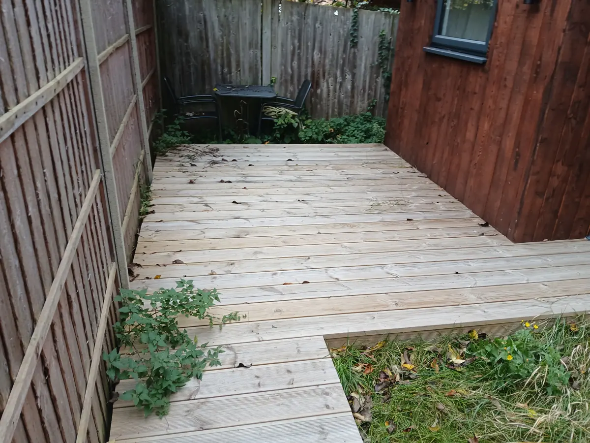Decking and ground around the garden building