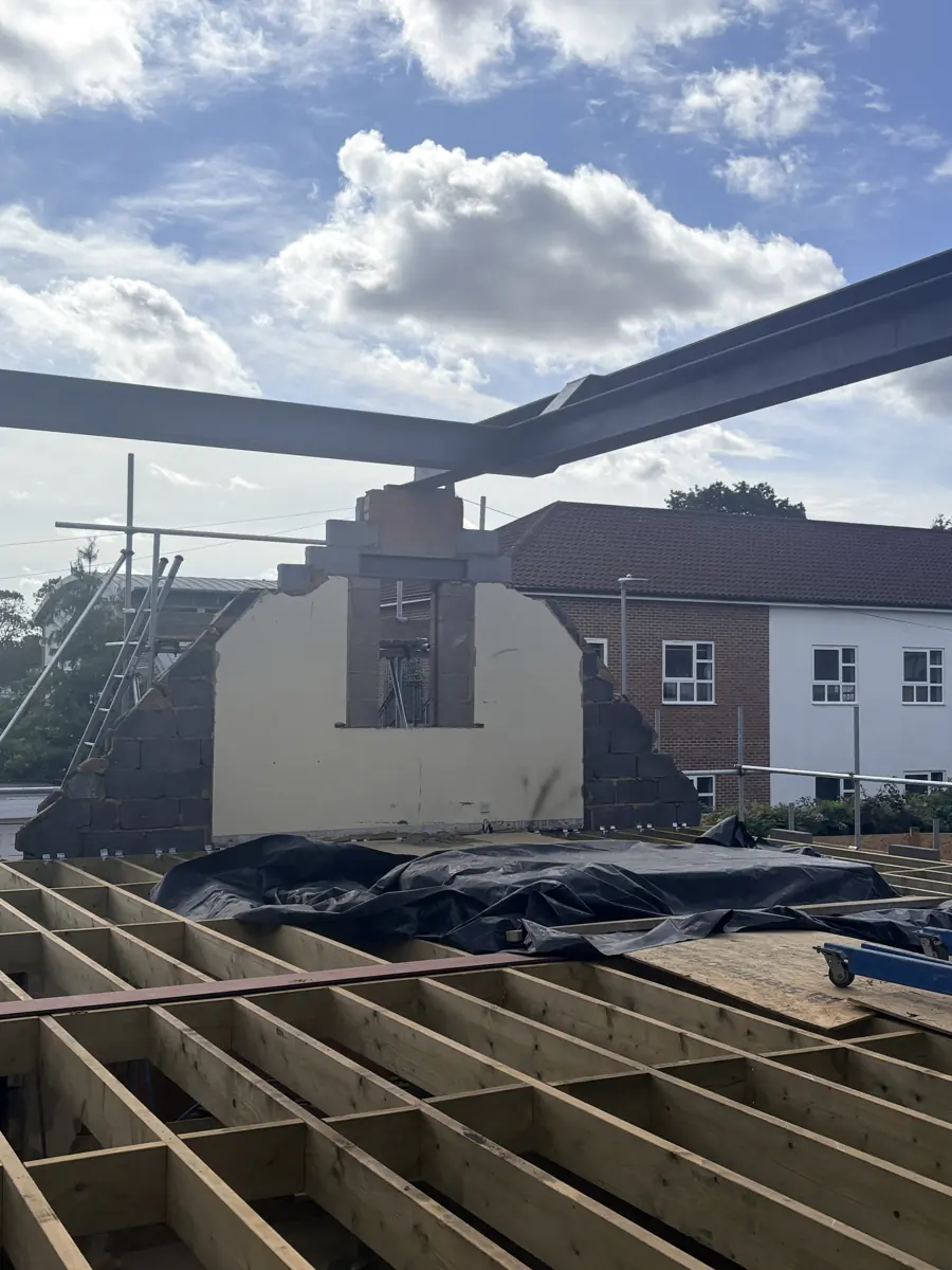 Steels landing on the retained wall above the new floor joists