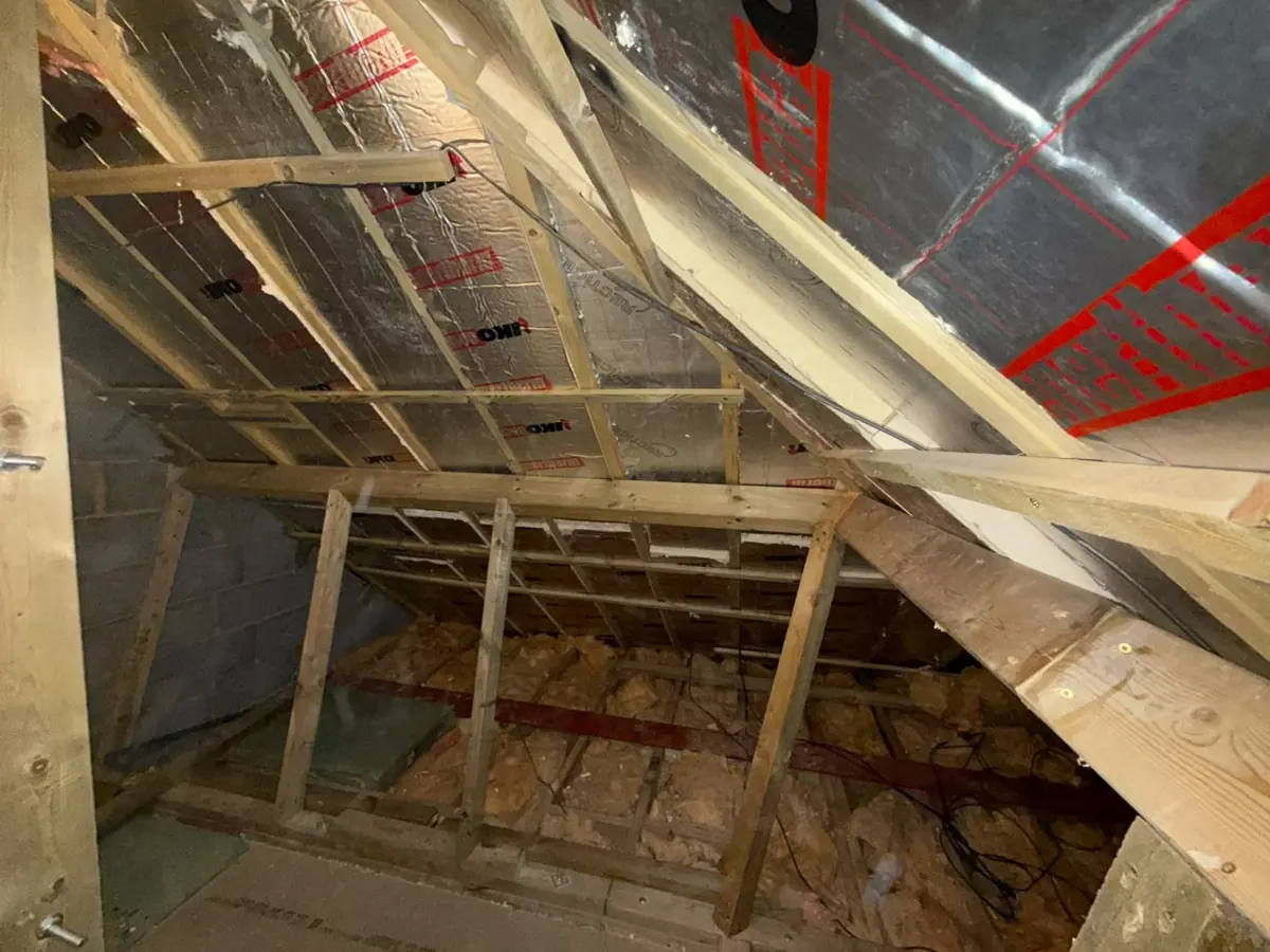 Loft framing with the new steel beam at ceiling joist level